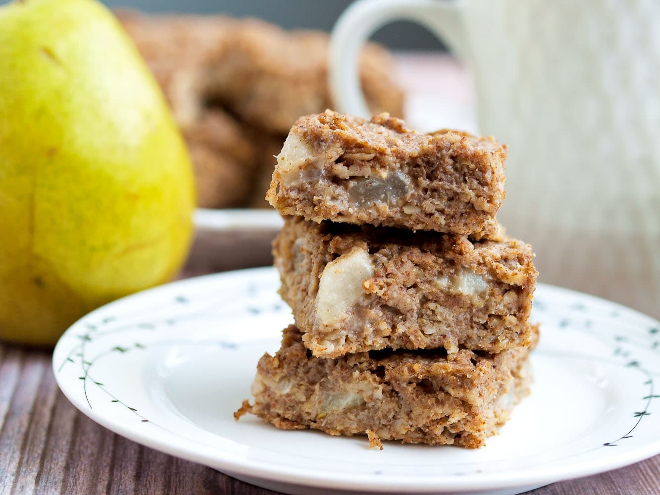 Fruit sweetened pear oatmeal bars recipe. These Pear Oatmeal Bars are made with NO added sugar, are vegan, and gluten-free. They make a perfect healthy breakfast or snack! Great for kids and toddlers, too.