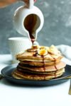 Healthy Pancake Recipe pouring maple syrup