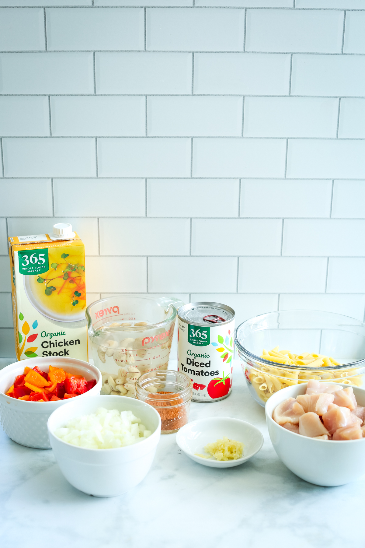 Recipe ingredients on a counter for chicken fajita pasta
