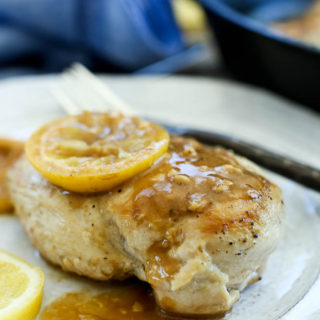 Easy Lemon Skillet Chicken Recipe--One breast with a lemon on top