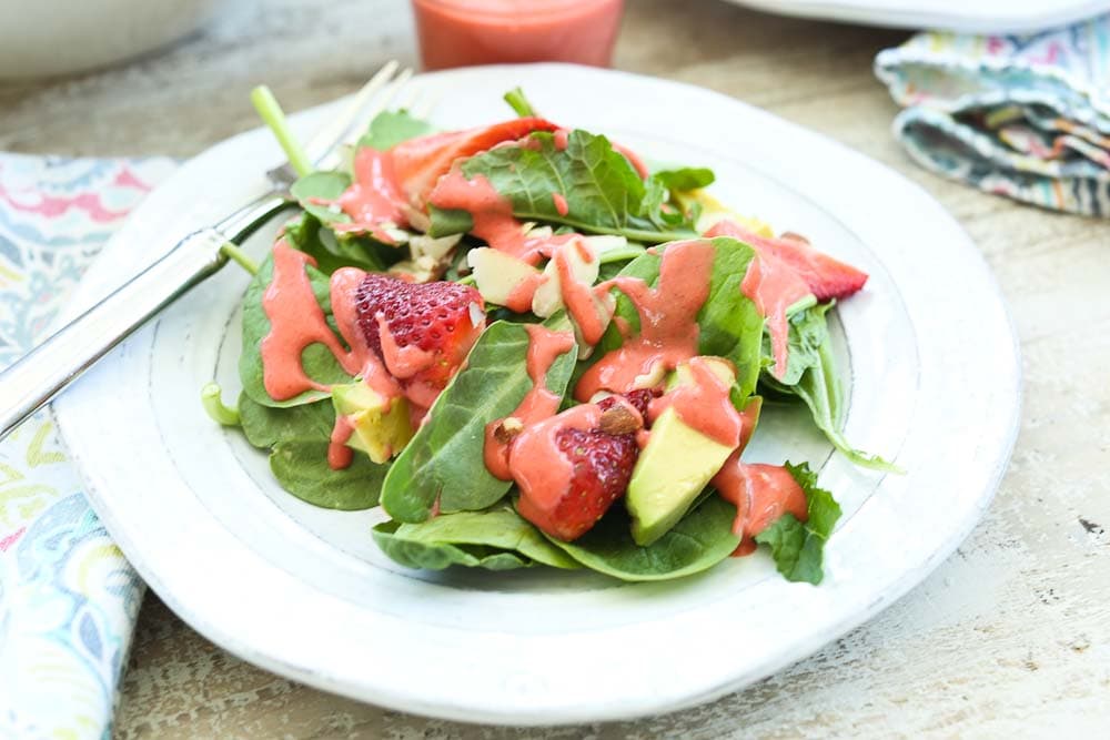 Close up picture of Spinach Strawberry Salad with Avocado and Strawberry Vinaigrette