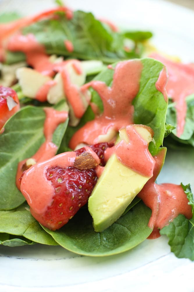 Close up picture of Spinach Strawberry Salad with Avocado and Strawberry Vinaigrette