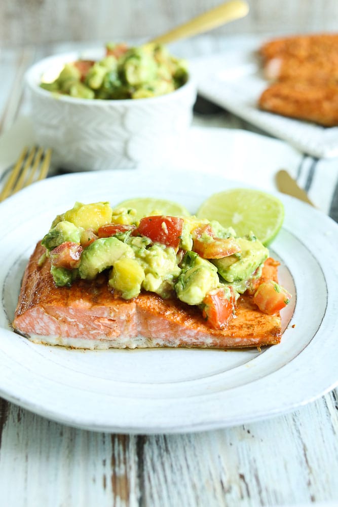 Chili Lime Baked Salmon Recipe with Pineapple Avocado Salsa on top #baked #salmon #easy #recipes #glutenfree #paleo #easy #healthyrecipes