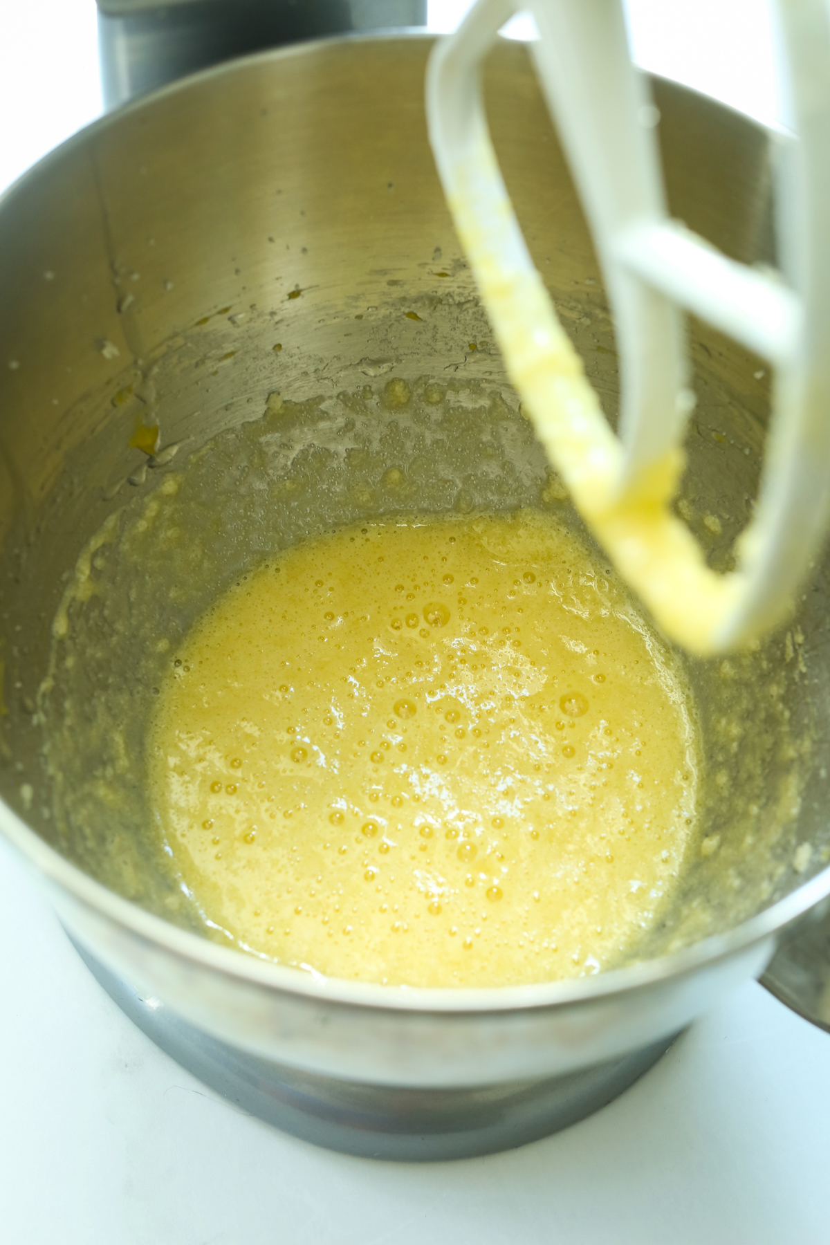 eggs, butter, and sugar mixed together in a stand mixer