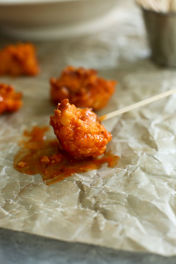 One Buffalo Cauliflower Popper on a toothpick 