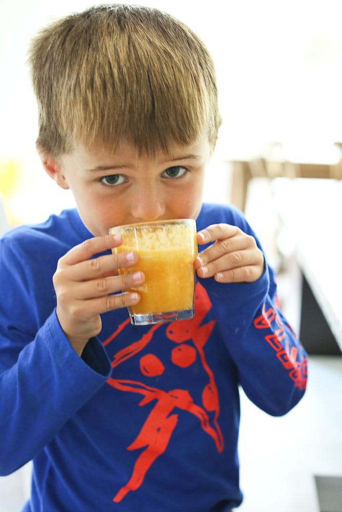 Luke enjoying MegaFood Kids Daily Multi Review Vitamin Juice for Kids 
