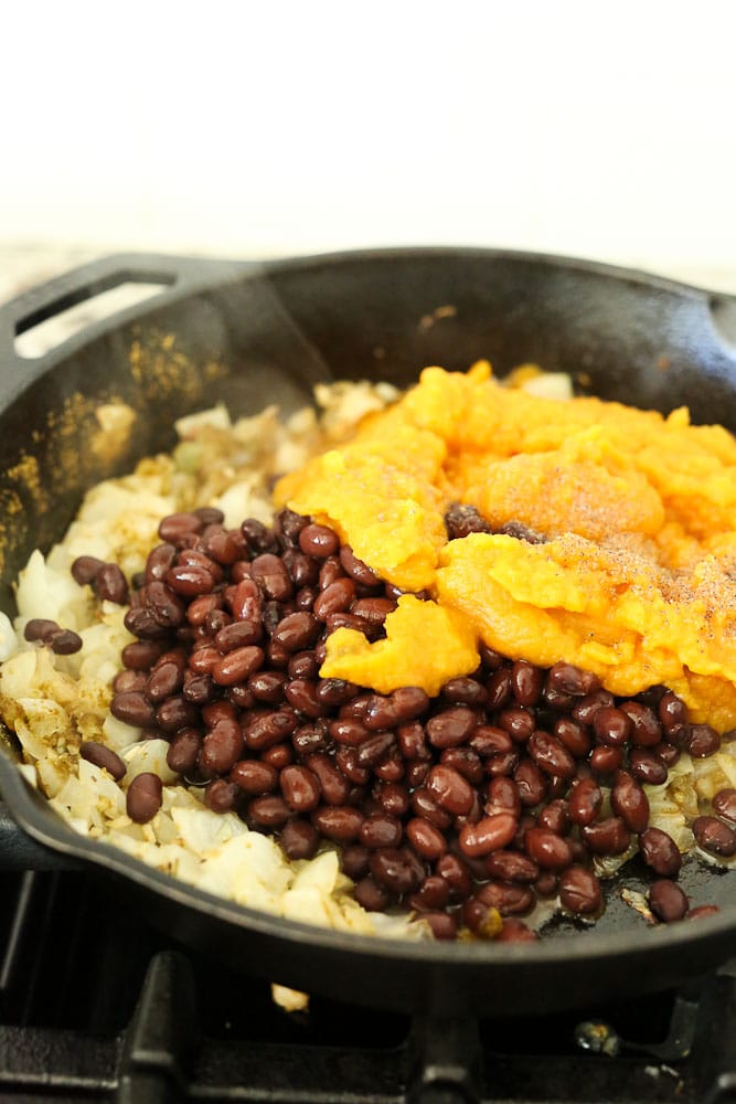 Preparing the mixture for ButternutSquash Black Bean Enchiladas recipe--ingredients in pan