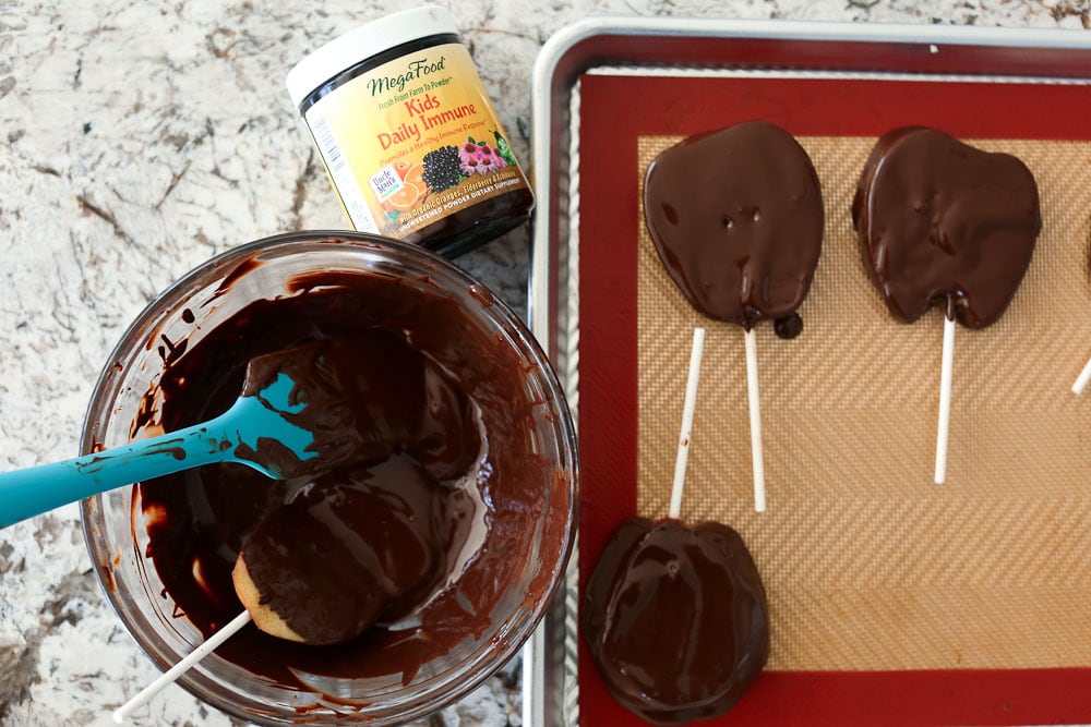 Chocolate Covered Apple Turkey Pops with MegaFood nutritional booster dipping the apples