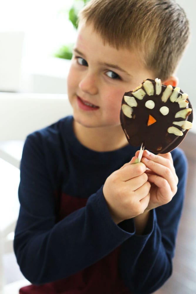 Luke holding his Chocolate Covered Apple Turkey Pops