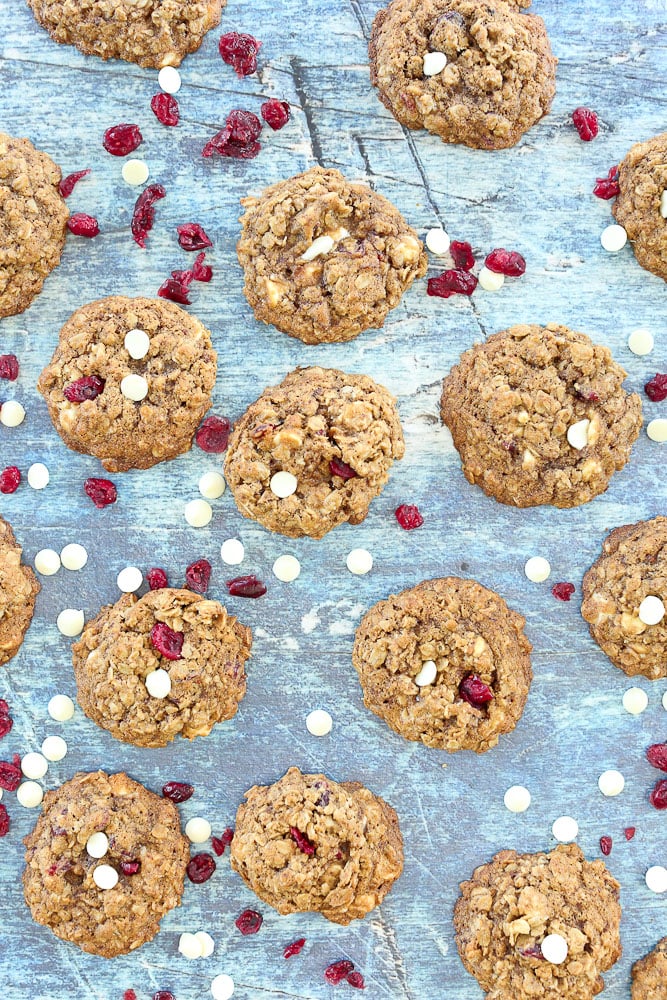 Cranberry White Chocolate Chip Oatmeal Cookies--the whole batch on the table with extra cranberries and white chocolate chips