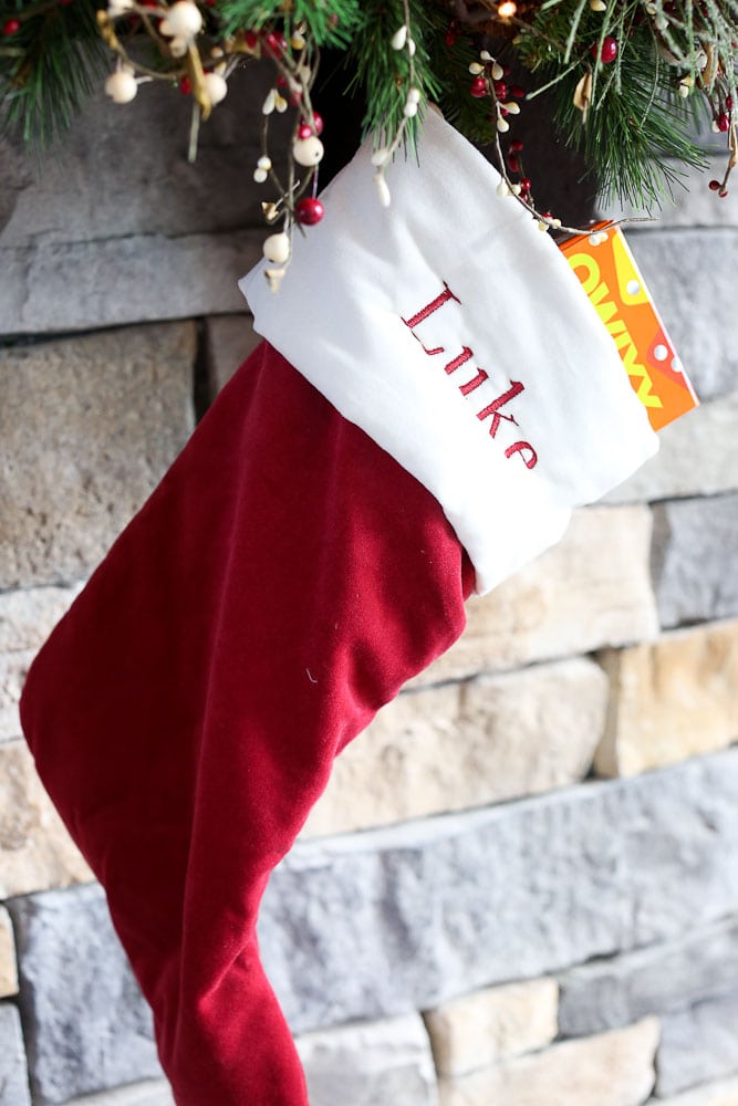 Dingle the original elf on the shelf--Luke's stocking with a gift in it