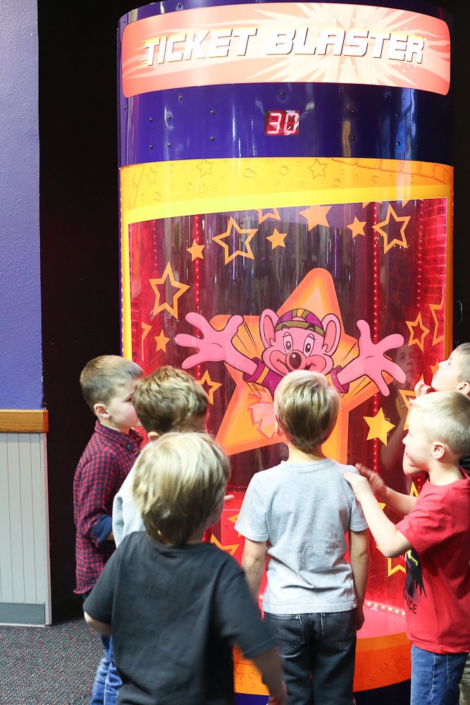 Luke's 6th Birthday Party at Chuck E Cheese's-looking at the Magic Ticket Blaster