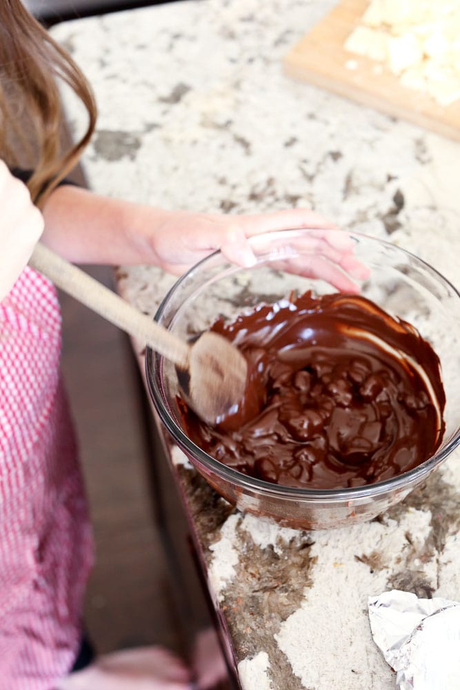 Homemade Peppermint Bark Recipe step by step instructions--stirring the melted chocolate