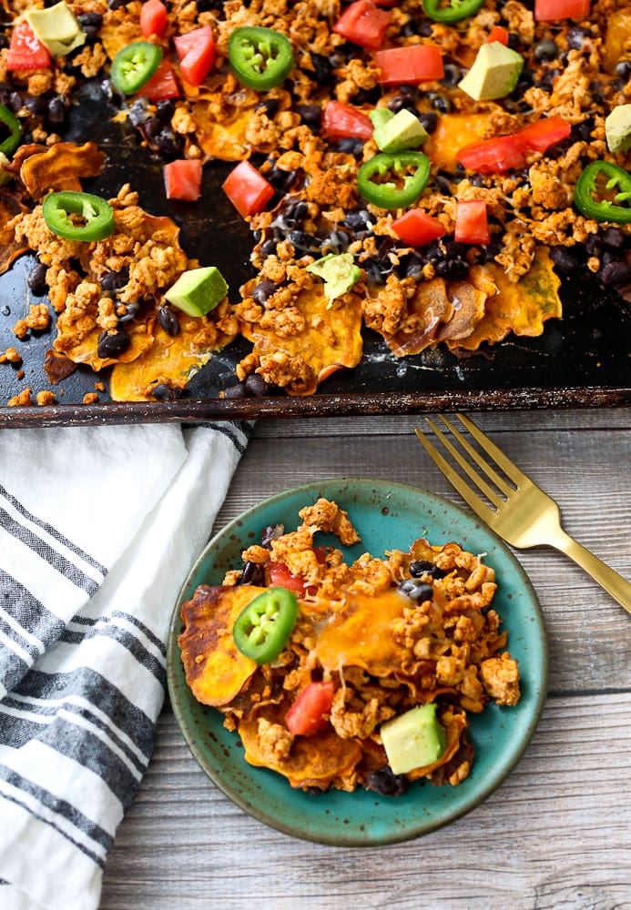Sweet Potato Nachos recipe one serving on a plate with the tray of nachos