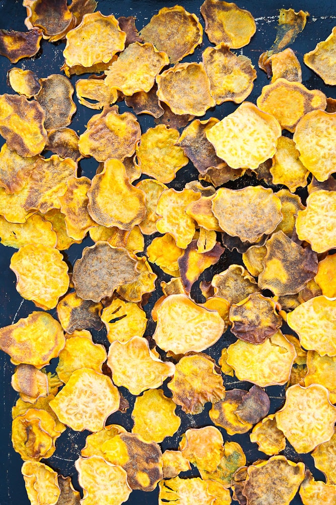 Sweet Potato Nachos Recipe the sweet potato chips on a baking sheet