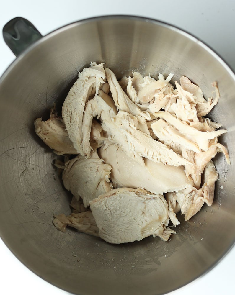 How to cook a whole chicken in the Instant Pot--shredding the cooked chicken after cooking