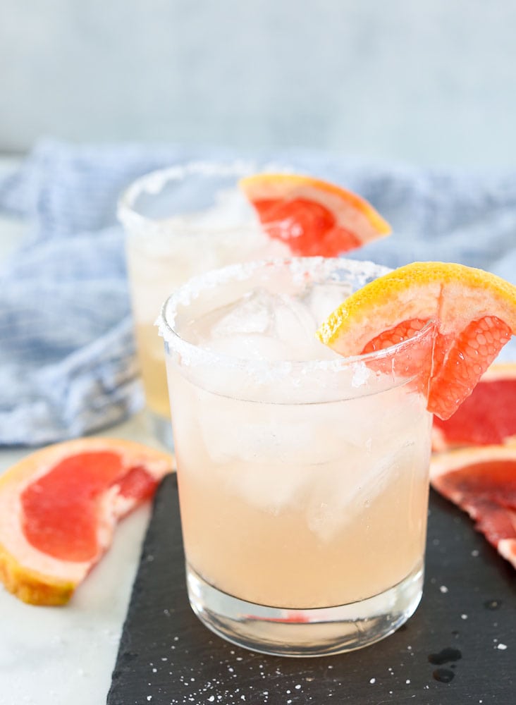 Grapefruit Margarita in two margarita glasses with grapefruit garnish