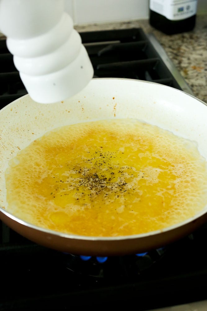 Shrimp Scampi Recipe-adding pepper to the skillet