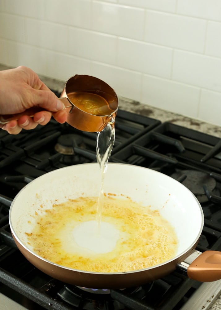 Shrimp Scampi Recipe-adding dry white wine to skillet