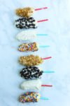 Greek Yogurt Frozen Banana Pops with different toppings