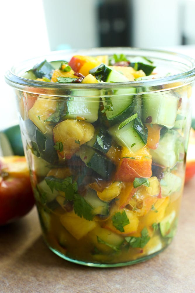 Cucumber Peach salsa in a glass container