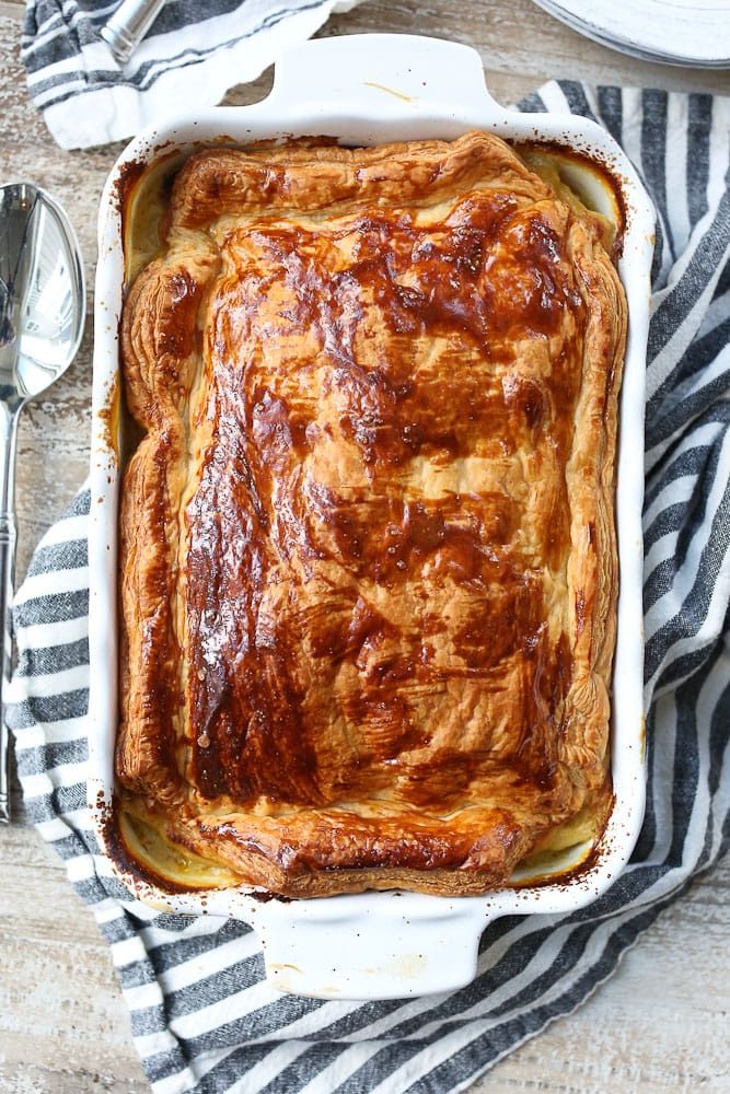 Dairy-free Chicken Pot Pie recipe whole pie in pan with browned puff pastry crust