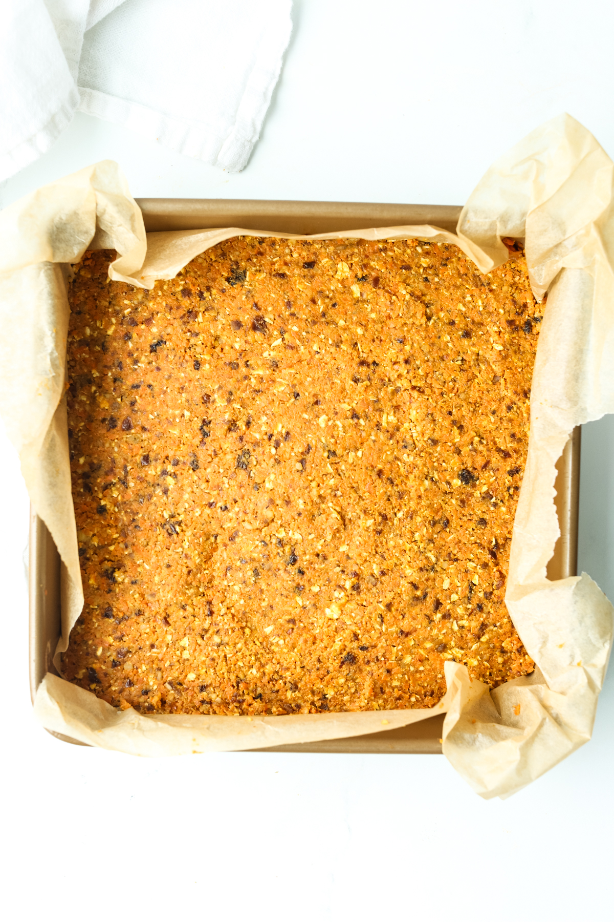 the mixture for healthy carrot cake bars in a pan