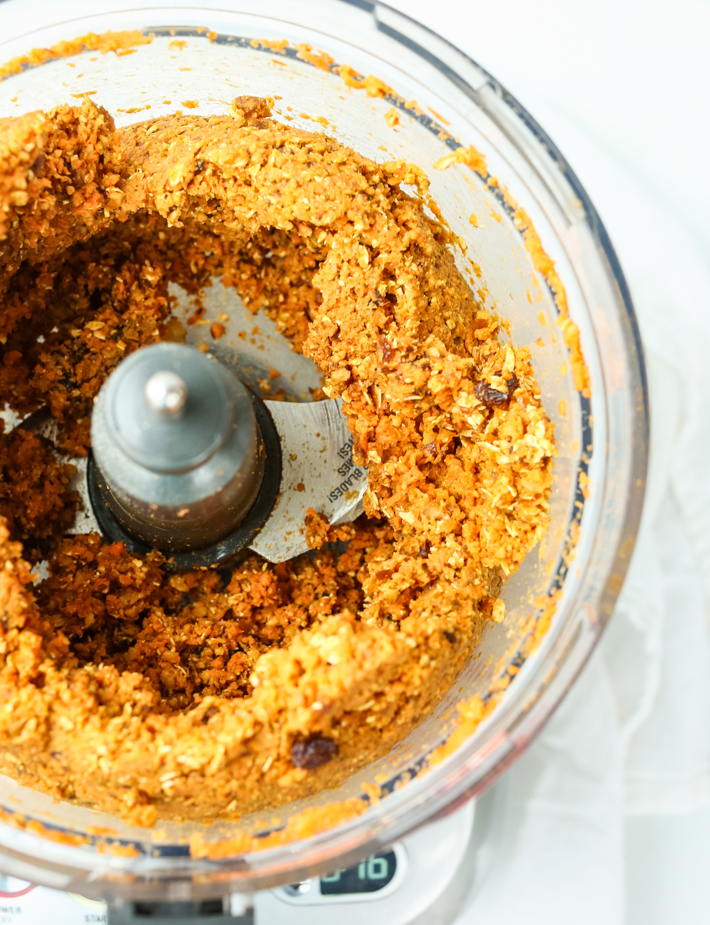 an orange mixture in a food processor