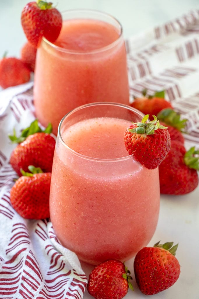 STRAWBERRY ROSE WINE SLUSHIES with strawberry garnish