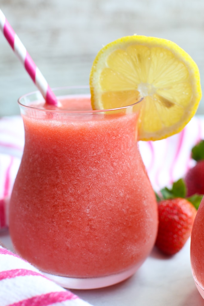 Frozen Strawberry Lemonade Recipe close up of glass with lemon garnish