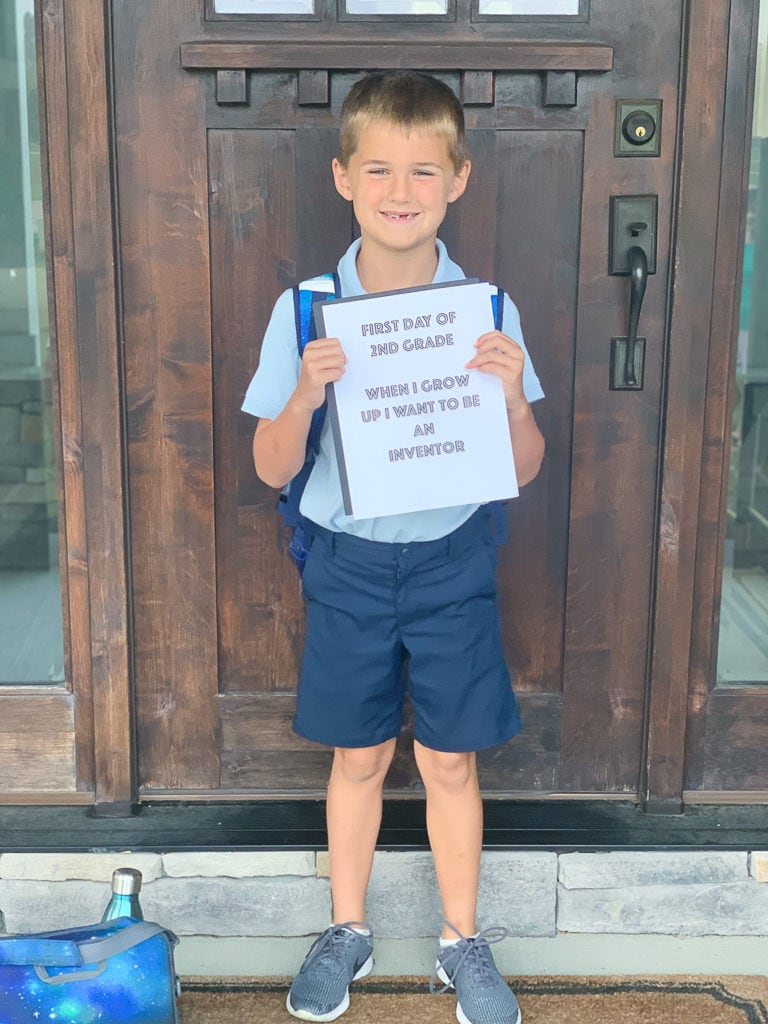 Luke first day of school 2019 in front of door