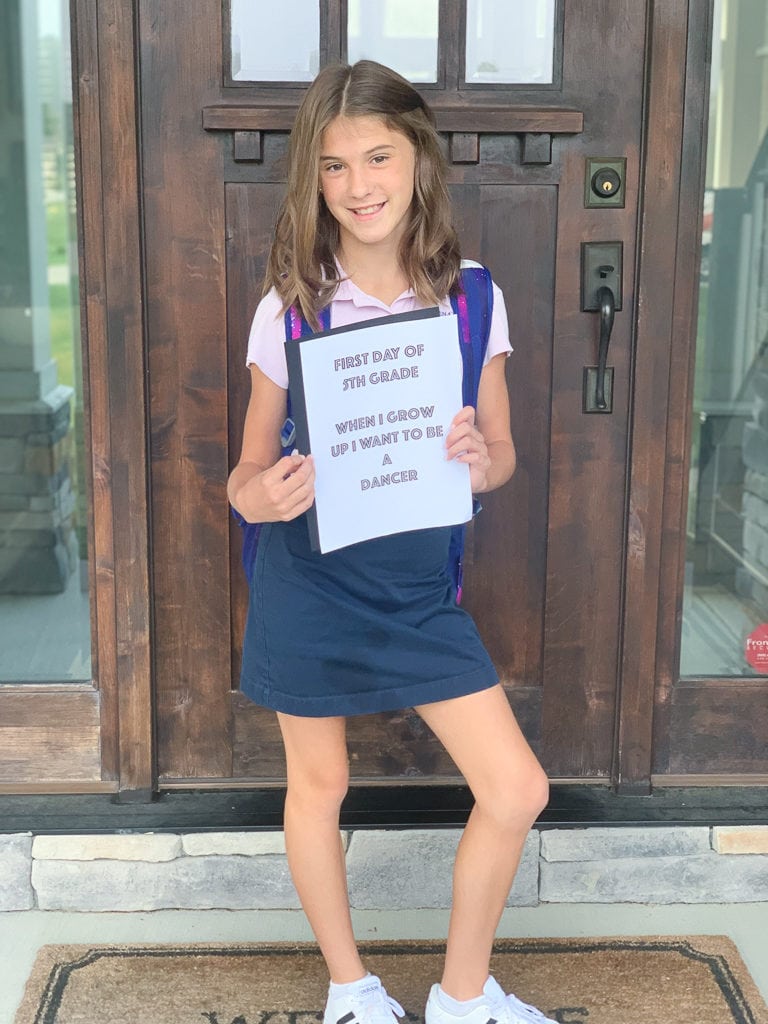 Meghan  first day of school 2019 in front of door