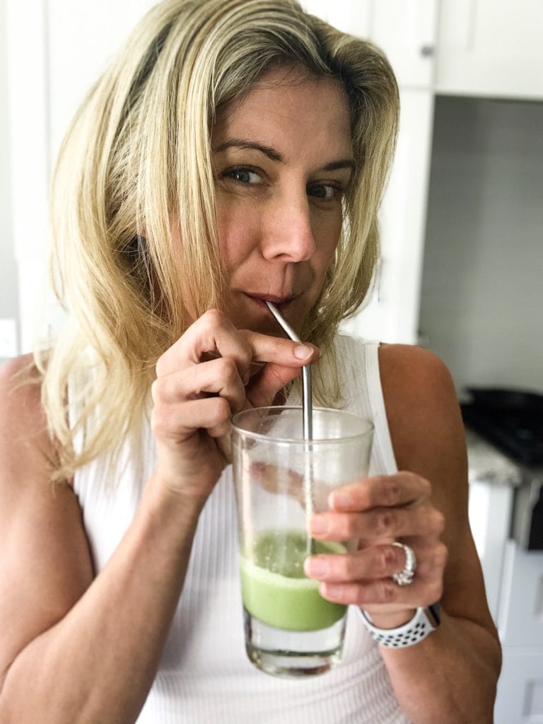 Best Reusable Straws- drinking from a stainless steel straw