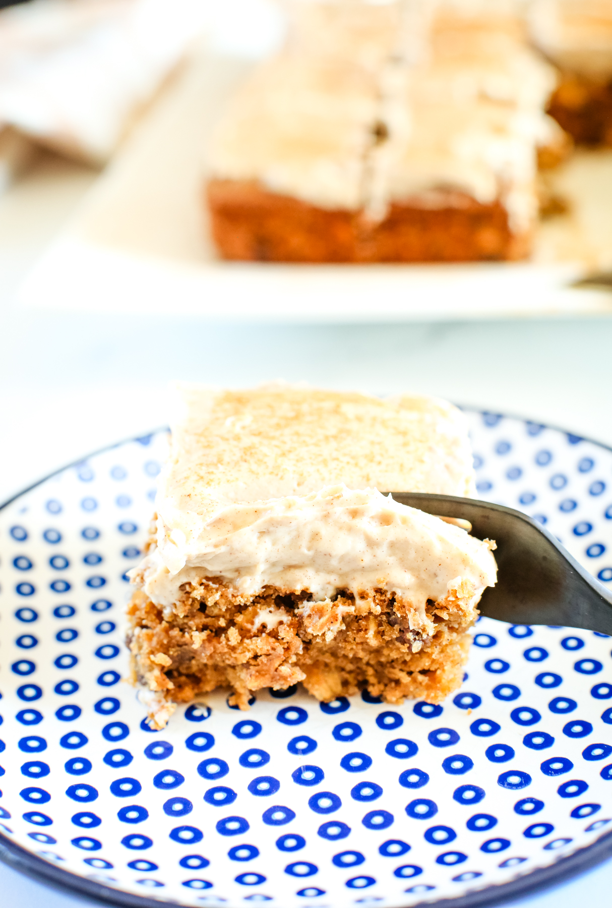apple pear cake with a fork taking a bite