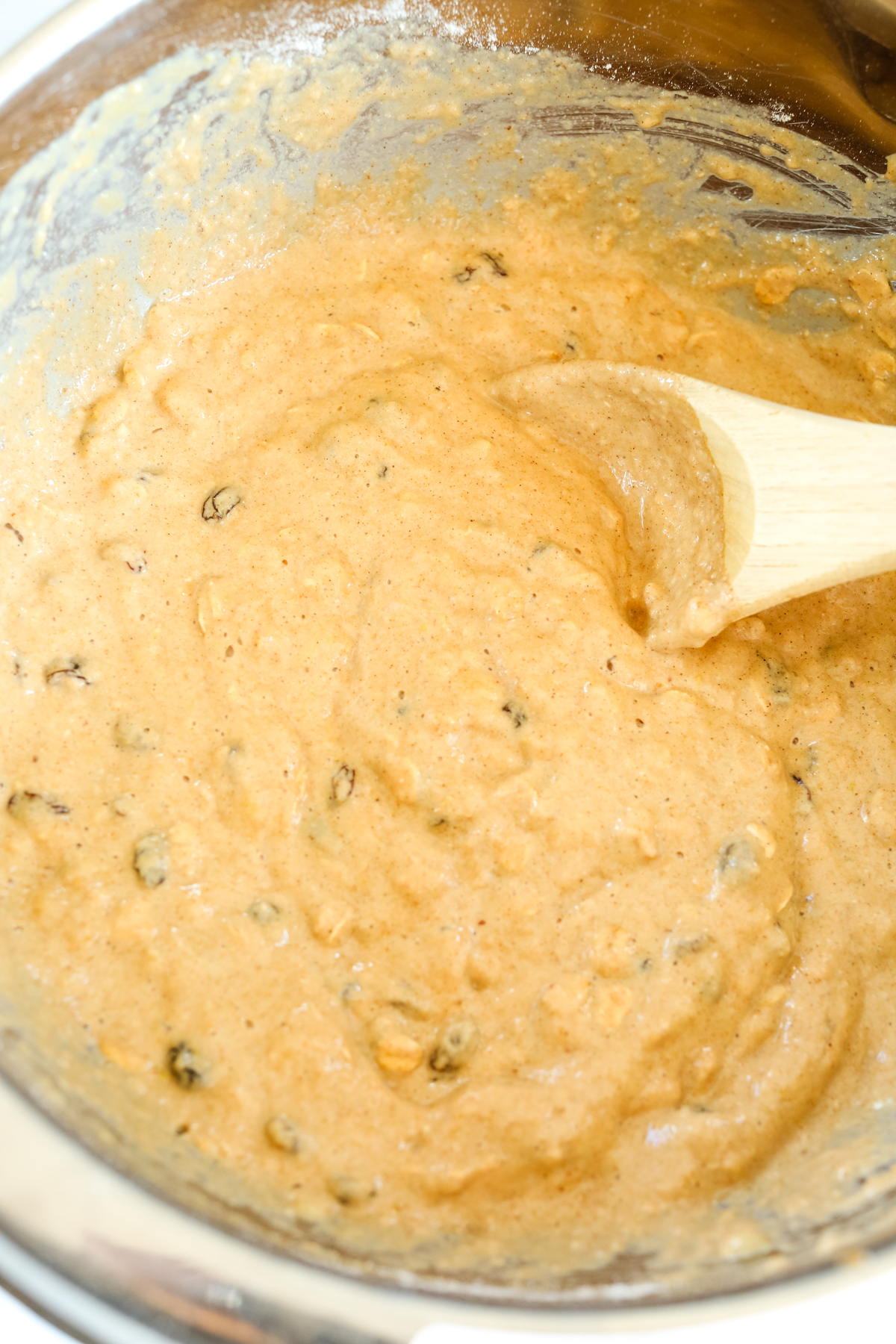 batter for apple pear cake with raisins mixed in