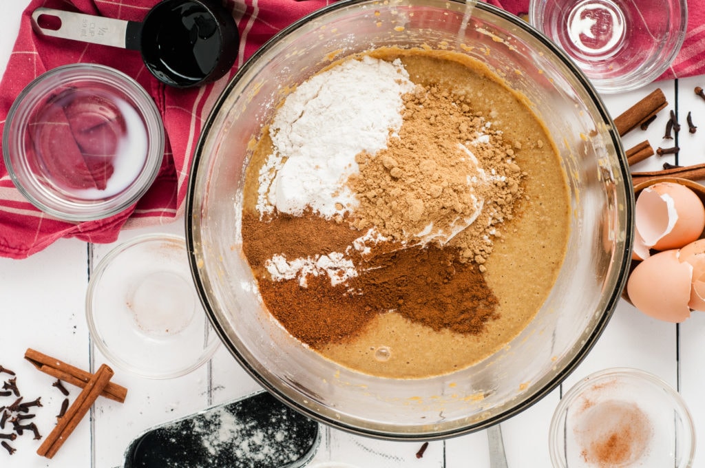 adding the flour and spices to the mixing bowl
