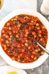 Marinara Sauce with Chickpeas and Kale recipe--in a large bowl with a spoon
