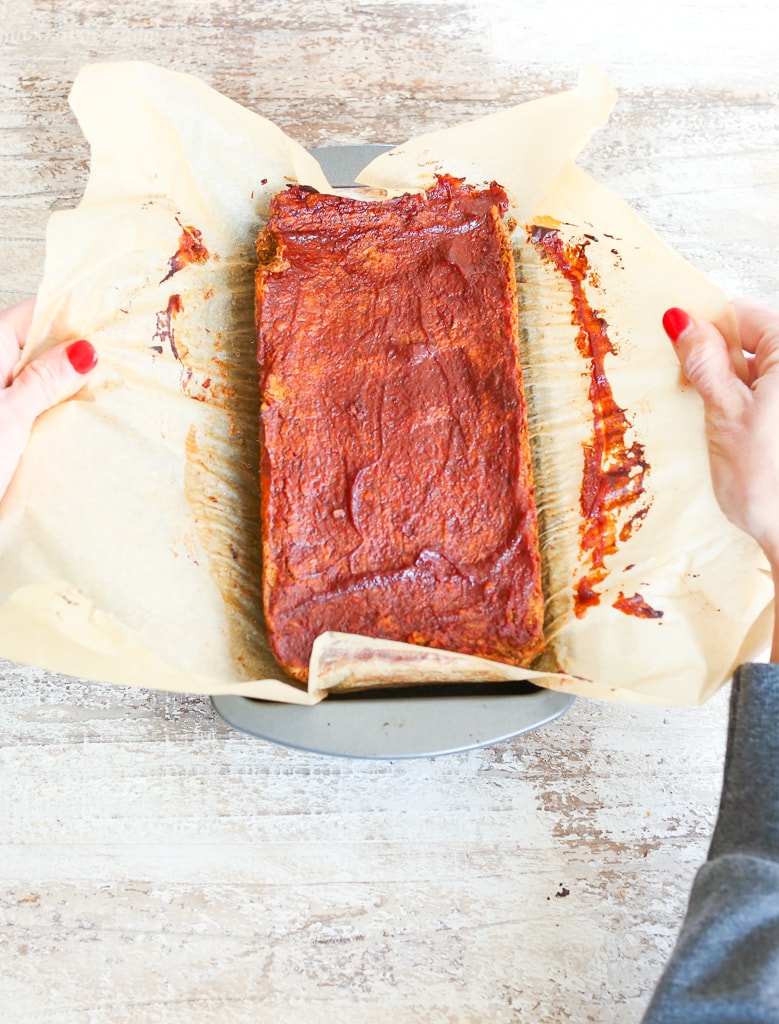 Removing baked loaf from the pan