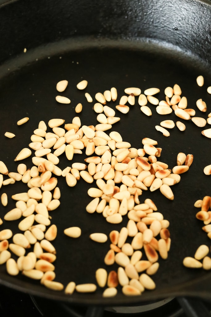 pine nuts in a pan lightly browned