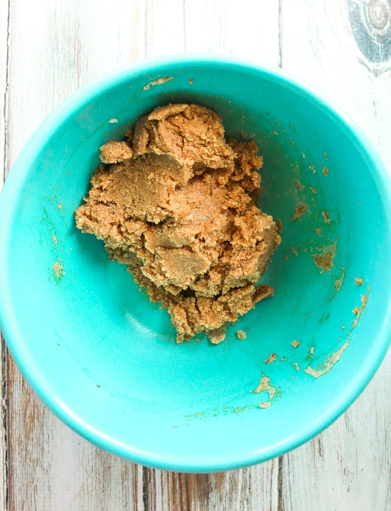 mixed together cookie dough in a turquoise bowl