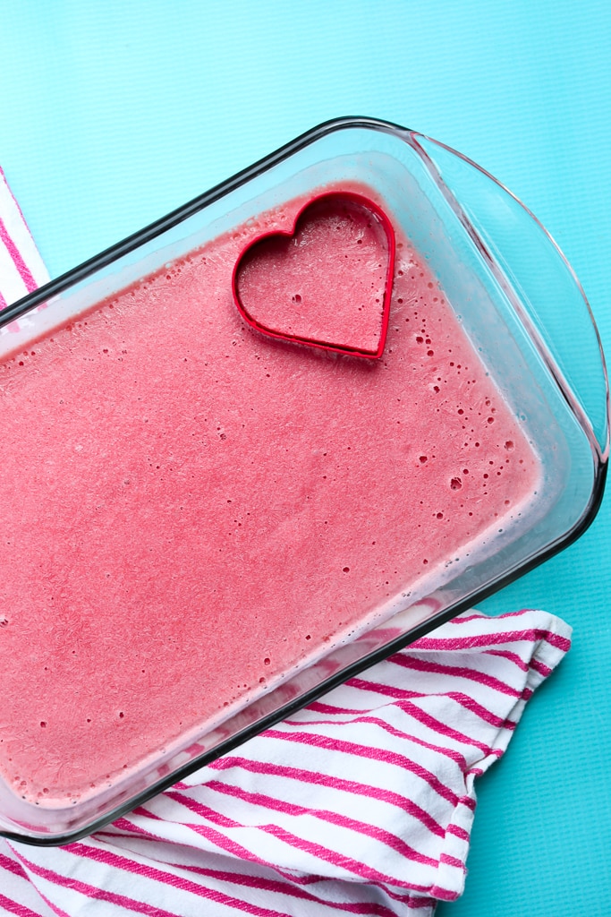the frozen strawberry mixture in a pan with a heart-shaped cookie cutter