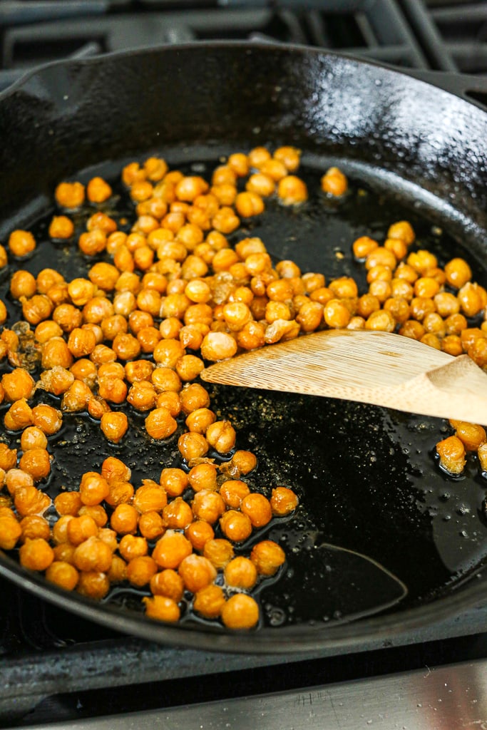 crispy chickpeas recipe instructions--in the pan with a tool