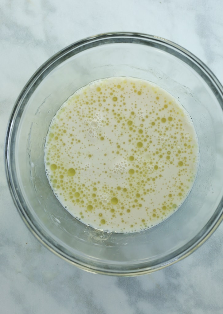 step 1 almond milk, oil, and vinegar in a. glass bowl