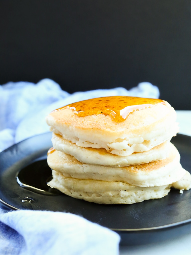 a stack of vegan pancakes with a little syrup on top