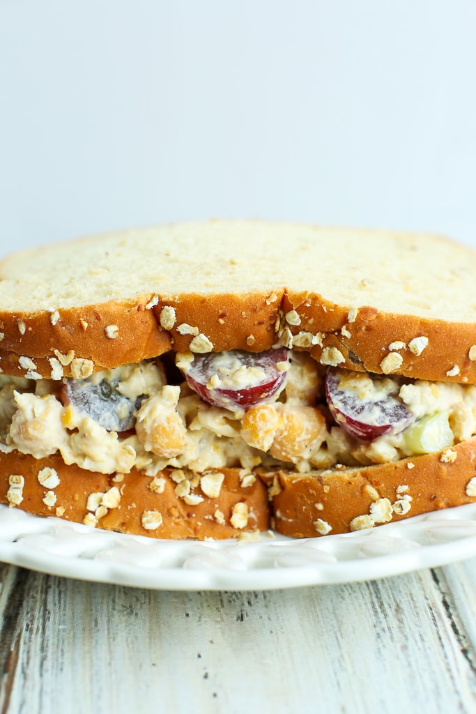 A Chickpea salad Sandwich on a white plate