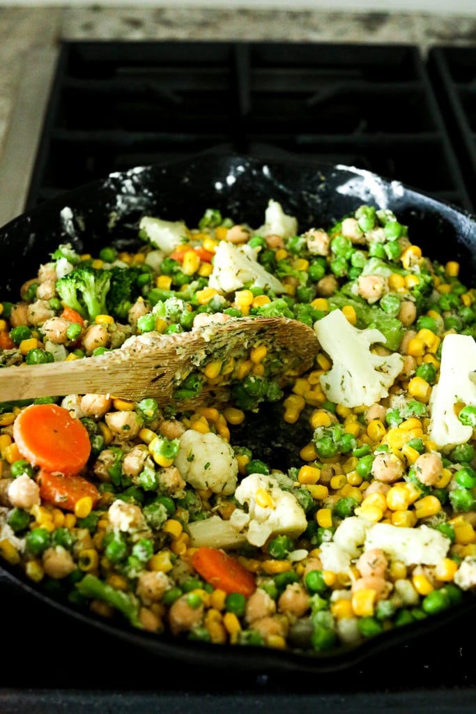 stirring vegetables coated with flour