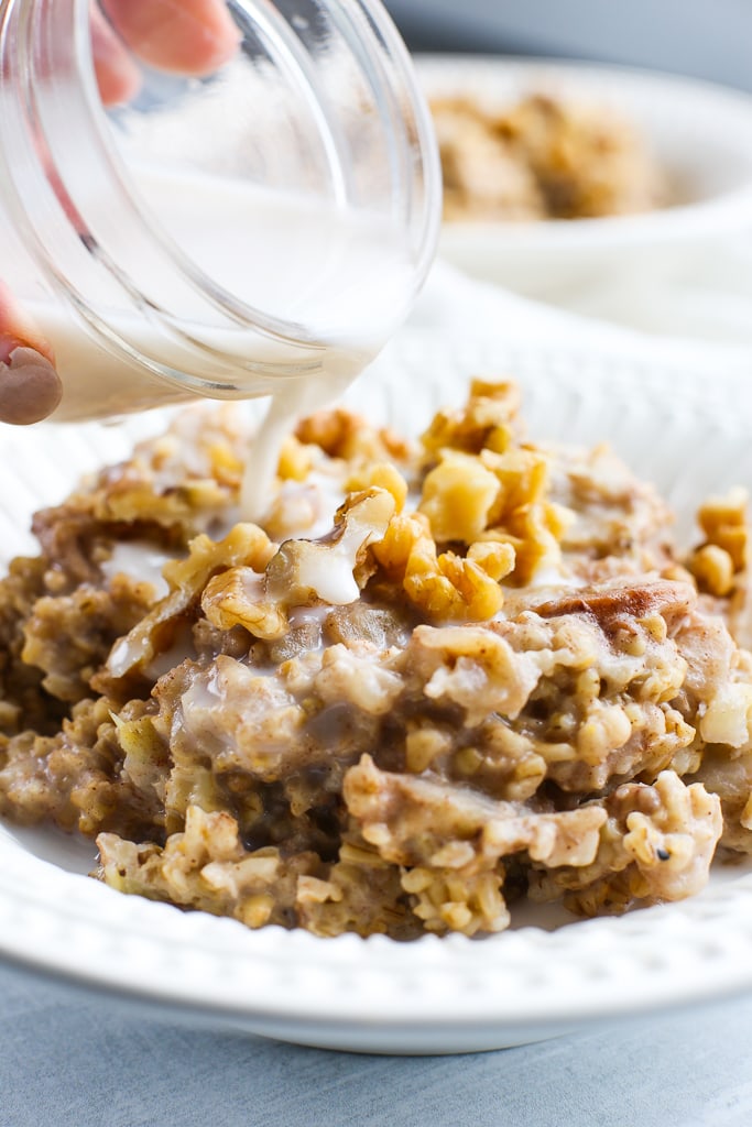 pouring milk on top of cooked Instant Pot steel cut oats