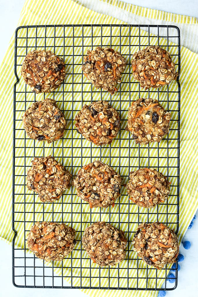 An overhead shot of a baking rack filled with carrot cake cookies