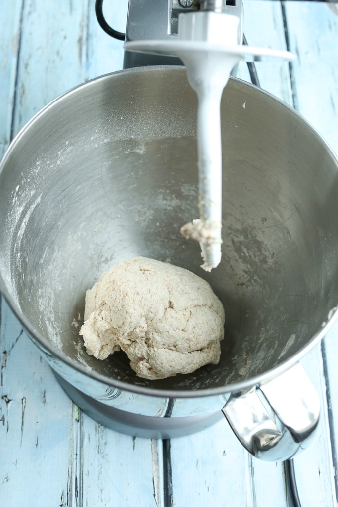 the dough of homemade pretzels in a stand mixer