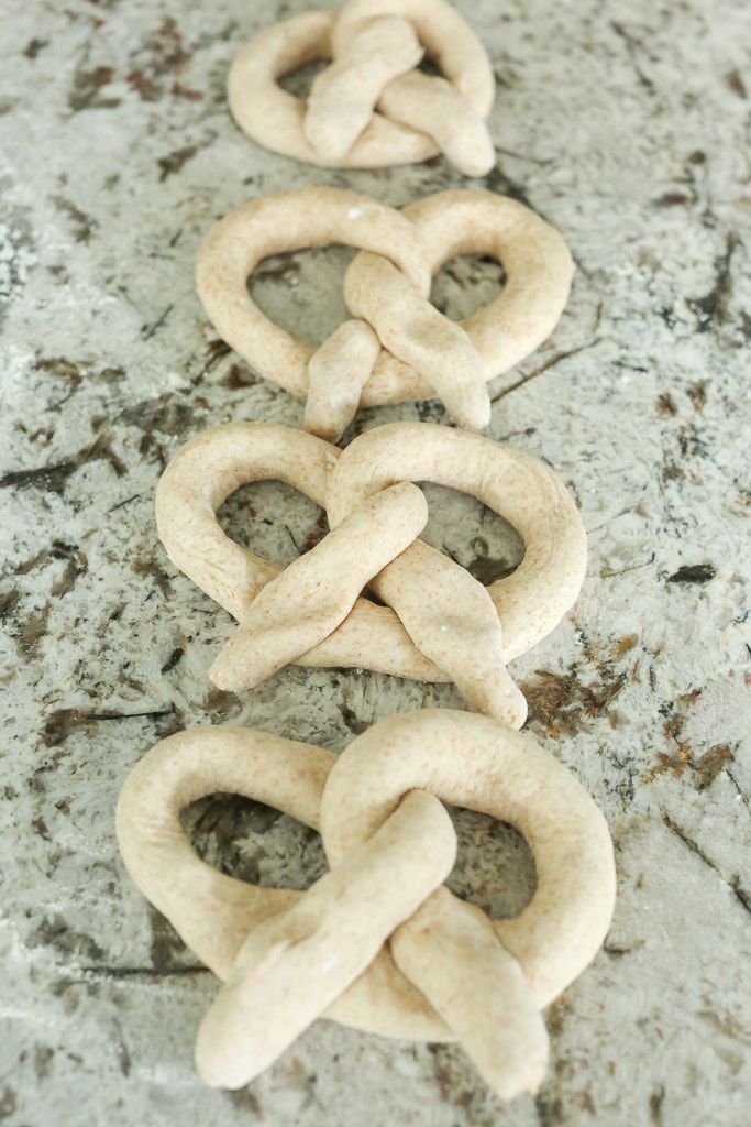 4 homemade pretzels before they are baked
